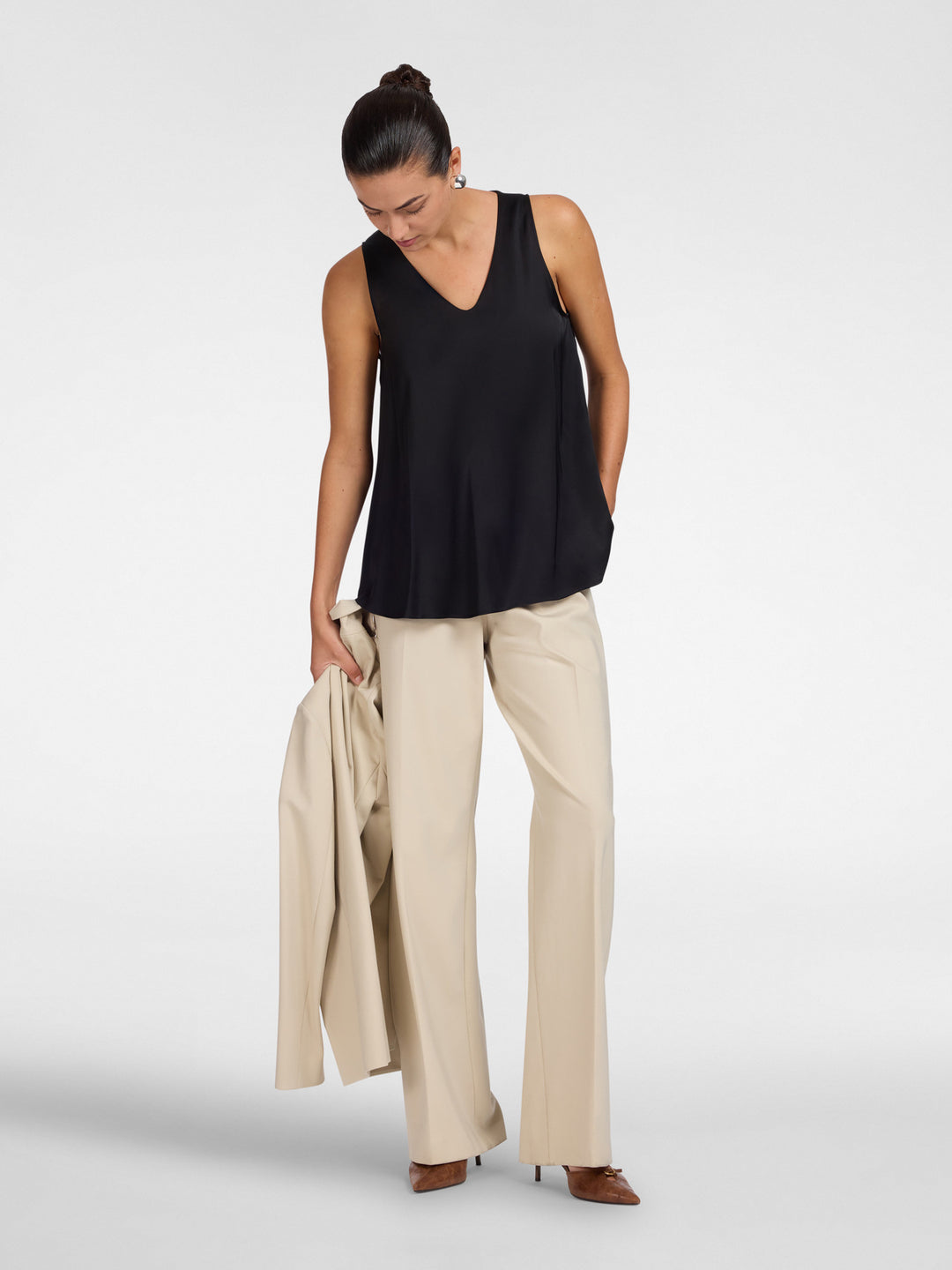 Black V-neck sleeveless camisole with relaxed fit and curved hem