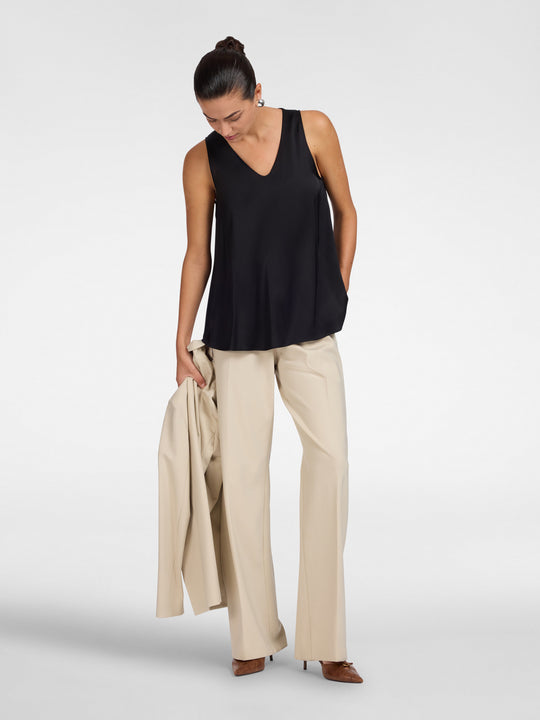 Black V-neck sleeveless camisole with relaxed fit and curved hem