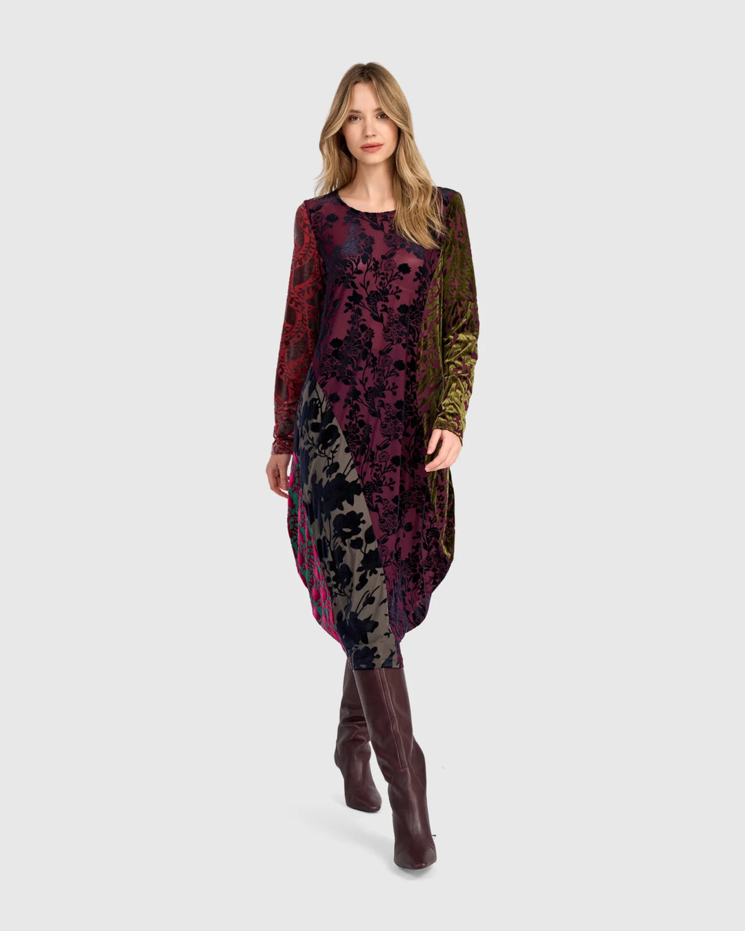 Burnout velvet mixed-print midi dress with round neck, long sleeves, and side-swept hem.