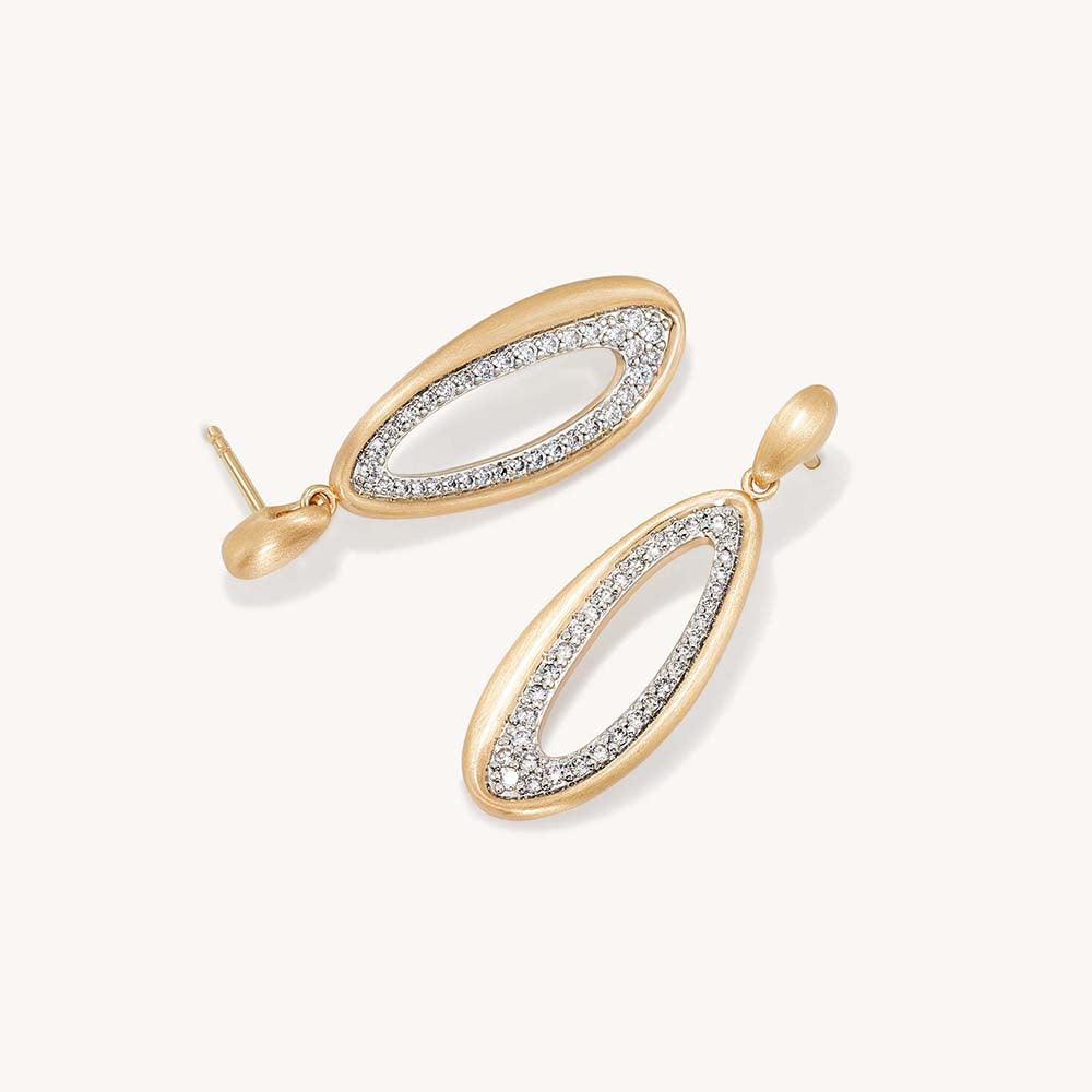 Open oval drop earrings in matte gold with pavé crystal inlay, shown as a pair