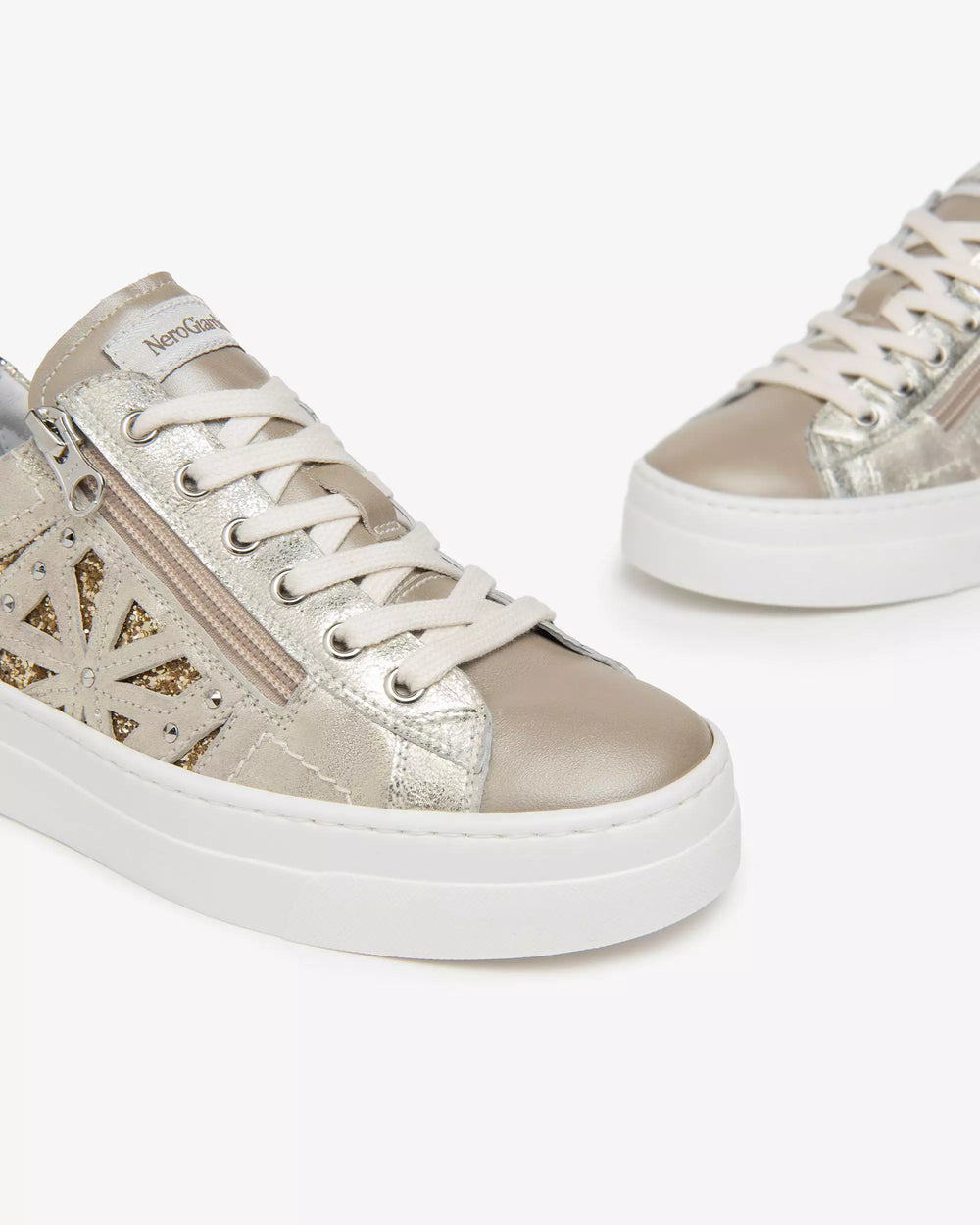 close up front view of Nero Giardini Paradise Zip Closure with Lace Platform Runner in Champagne