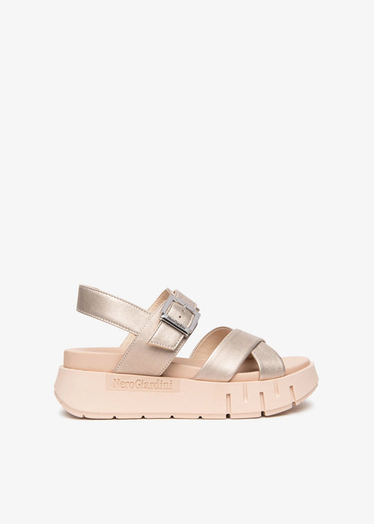 Beige sandal with a platform sole on a white background