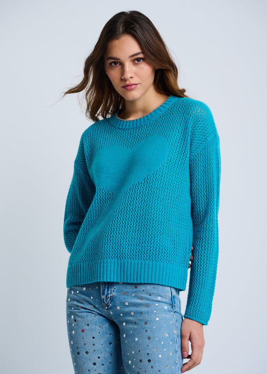 front view of plus size Lisa Todd Open For Love Waffle Knit Long Sleeve Sweater with Heart in Grotto