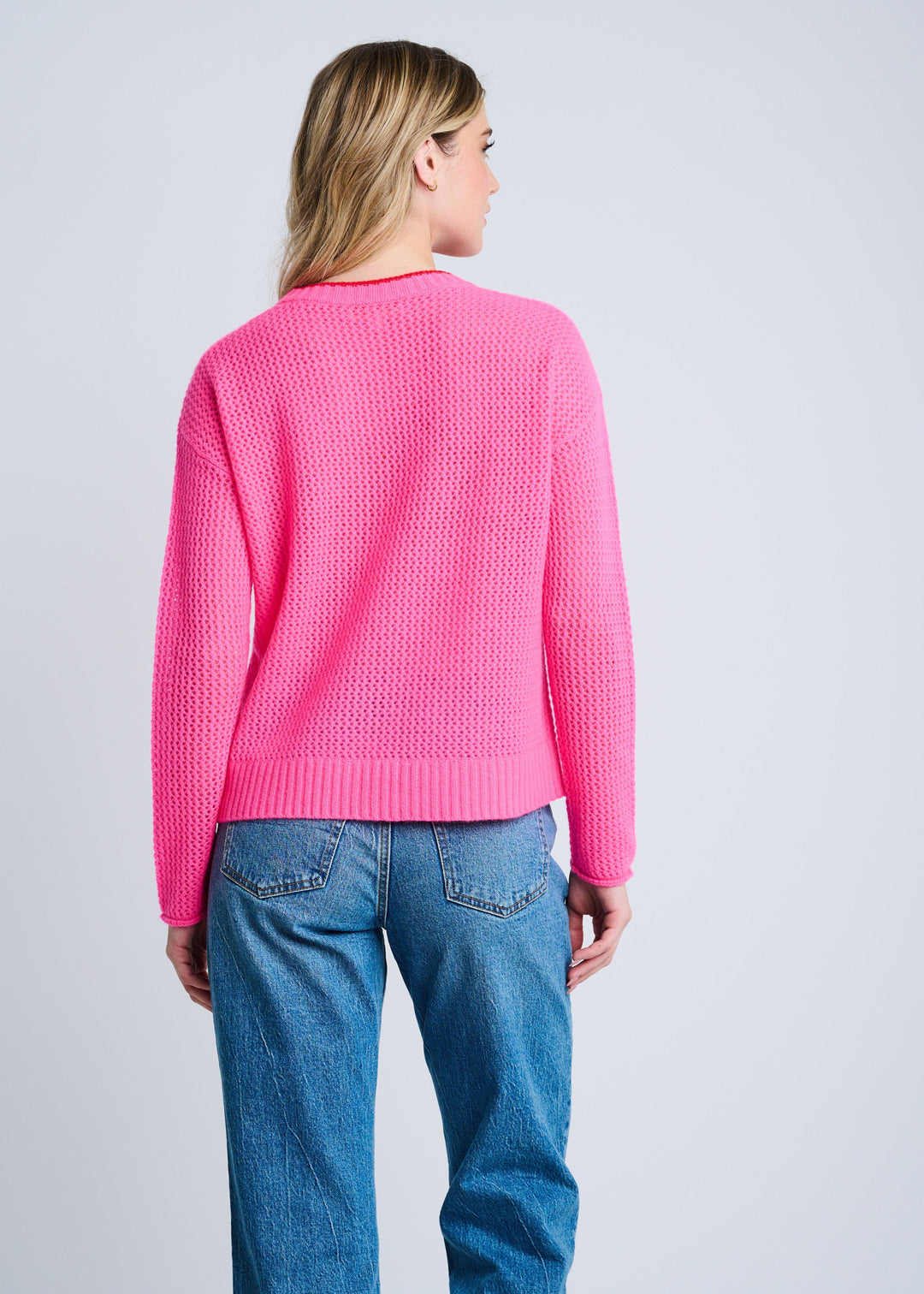 back view of plus size Lisa Todd Open For Love Waffle Knit Long Sleeve Sweater with Heart in Neon Pink