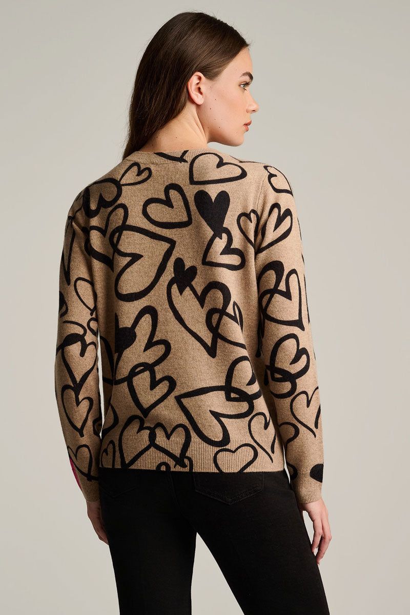 Cashmere heart-print sweater, back view in biscuit beige with black hearts