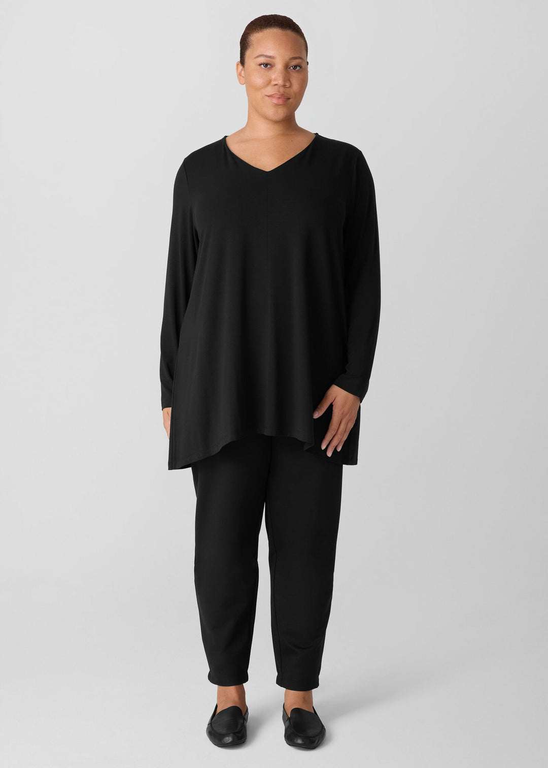front view on plus size model of Eileen Fisher Fine Stretch Jersey V-Neck Long Slv. Tunic in Black