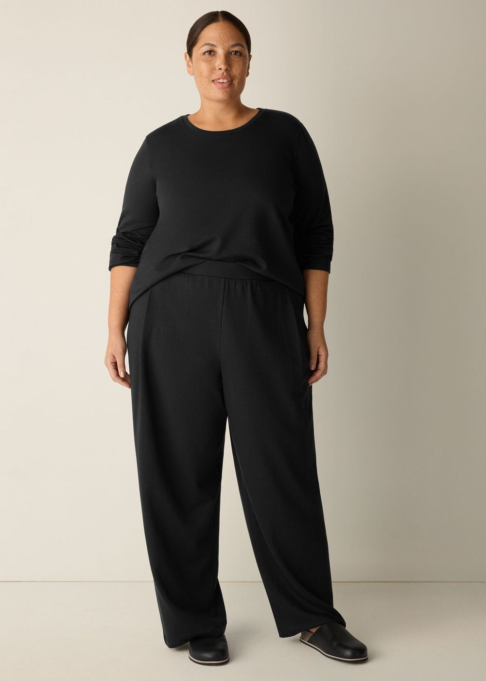 front view of plus size Eileen Fisher Cozy Brushed Terry Hug Straight Pleated Ankle Pant in Black