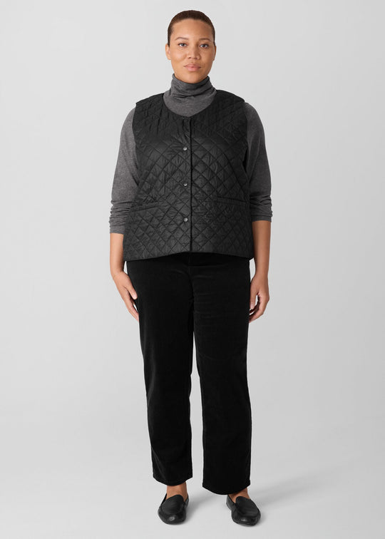 front view on model of plus size Eileen Fisher Eggshell Nylon V-Neck Vest with Snaps in Black