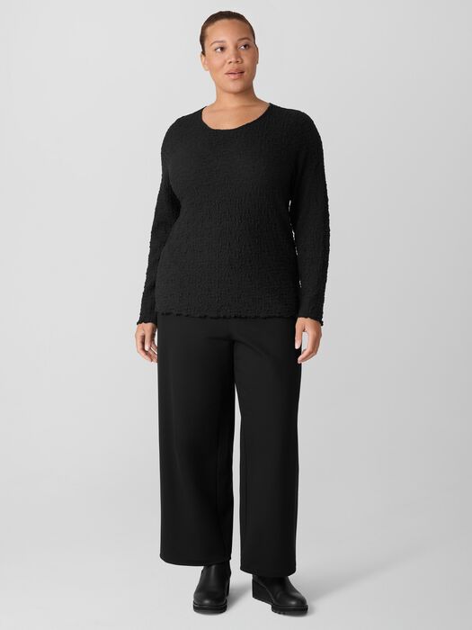 Long-sleeve textured bubble jacquard top with round neckline, worn by model, front view