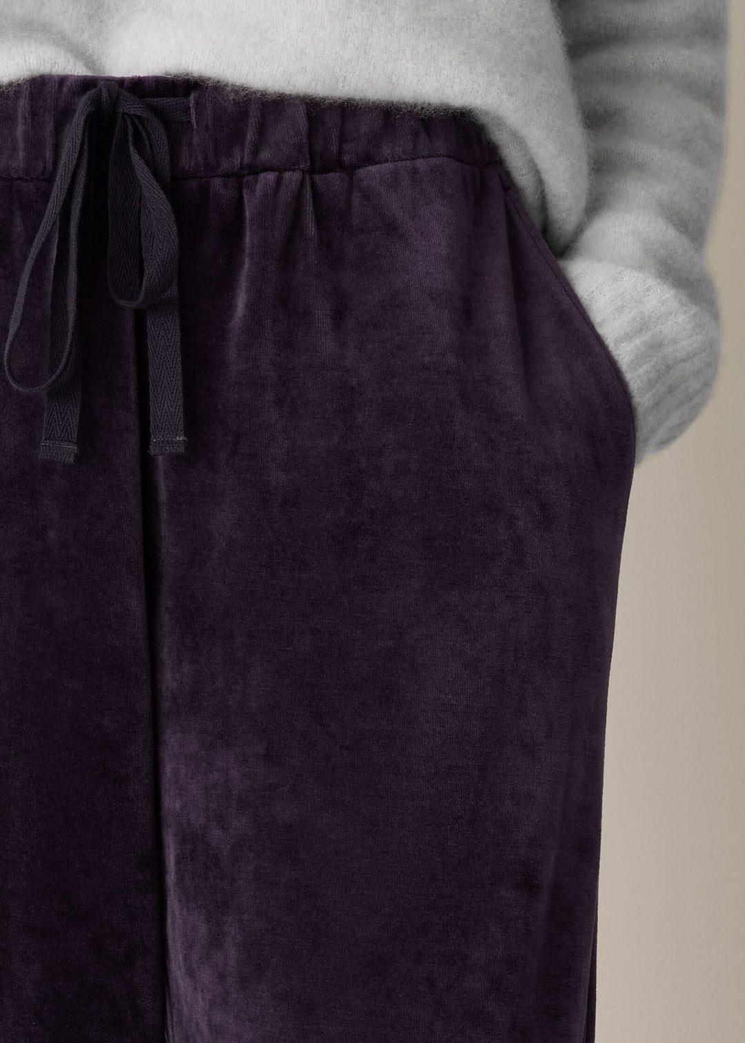 close up front view of plus size Eileen Fisher Cozy Velour Knit Wide Leg Full Length Drawstring Pant in Aubergine