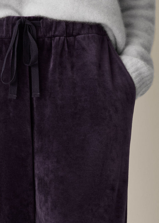 close up front view of plus size Eileen Fisher Cozy Velour Knit Wide Leg Full Length Drawstring Pant in Aubergine