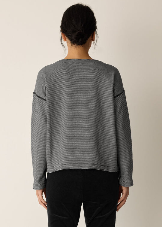 back view of plus size Eileen Fisher Double Knit Organic Cotton Round Neck Reversible Top in Black Ivory