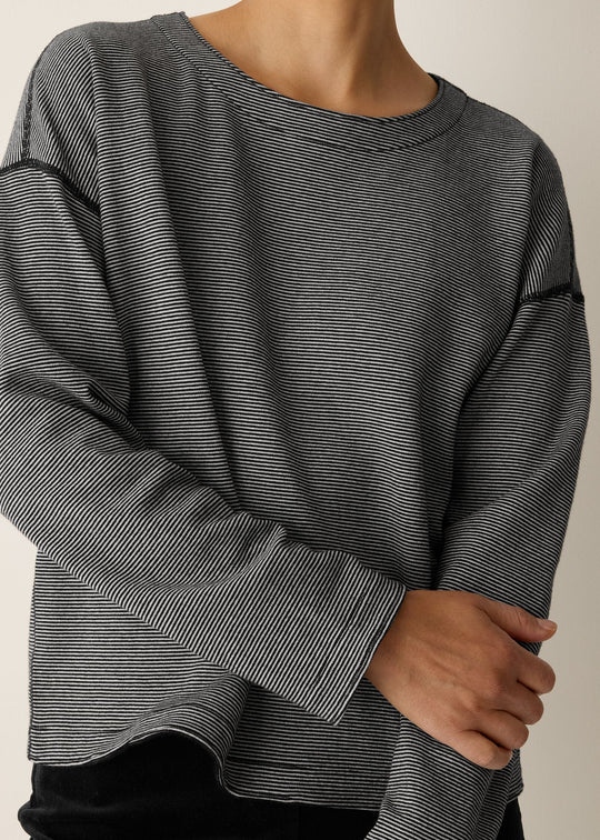 close up front view of plus size Eileen Fisher Double Knit Organic Cotton Round Neck Reversible Top in Black Ivory