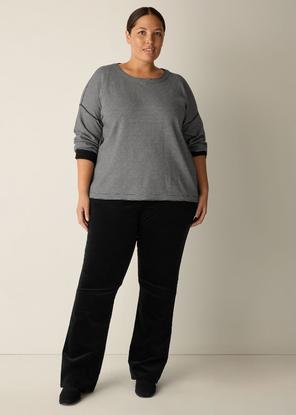 front view of plus size Eileen Fisher Double Knit Organic Cotton Round Neck Reversible Top in Black Ivory