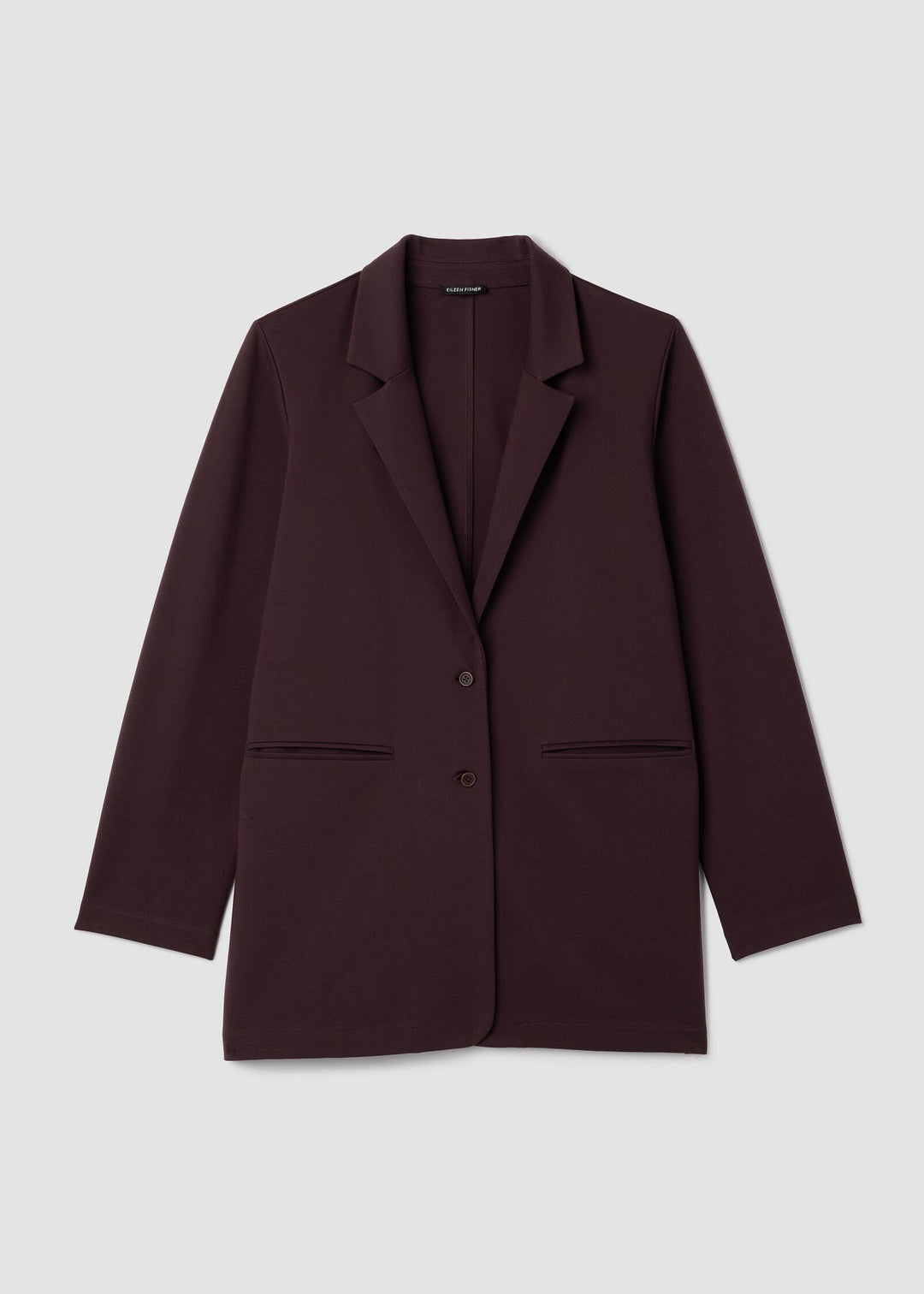 Brown blazer on a light gray background