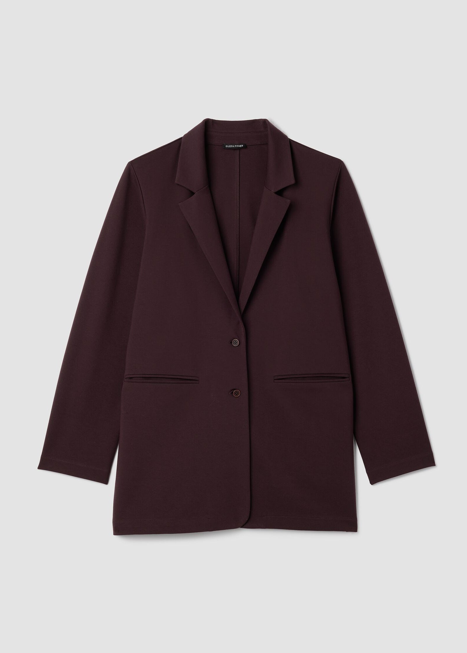 Brown blazer on a light gray background