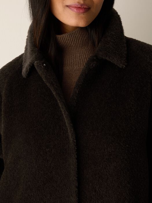 Coffee-brown textured coat collar with button placket and dark inner trim