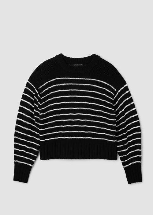 Black crewneck sweater with white cord-knit stripes, ribbed cuffs and hem.