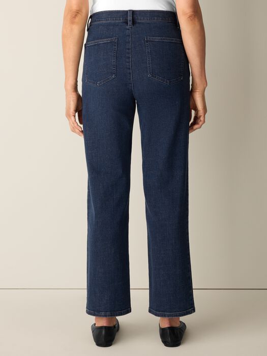 Straight-leg ankle jeans in dark indigo denim, back view on model showing rear pockets