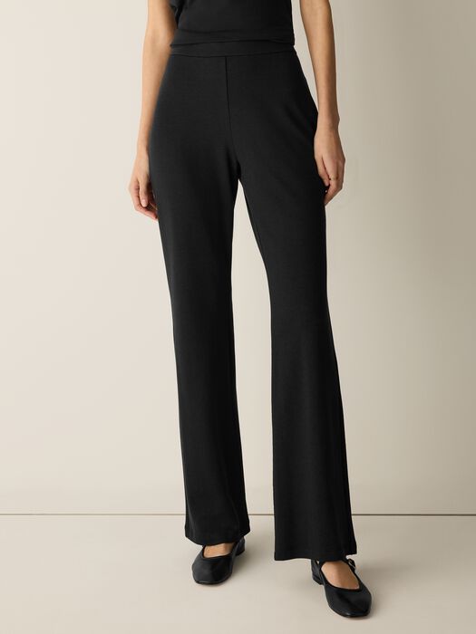 Black wide-leg kick flare pants with high waistband, front view on model