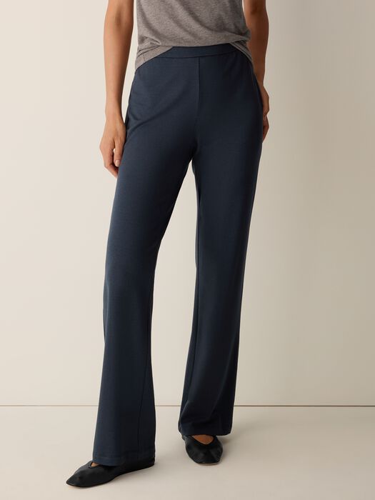 Dark navy wide-leg kick pants with clean seam detail, front view on model