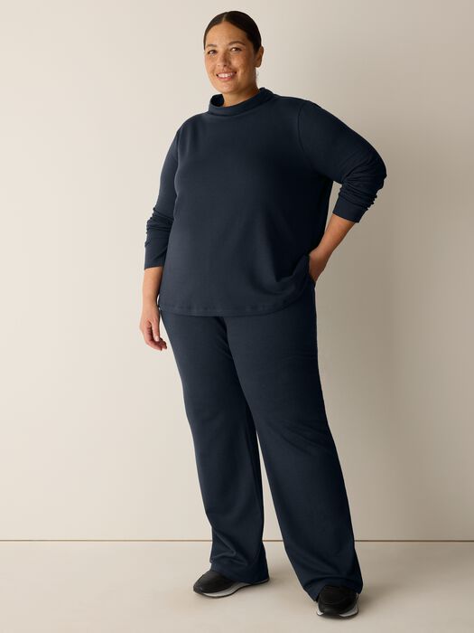 Full-length navy wide-leg kick pants with matching long-sleeve top, front view on model