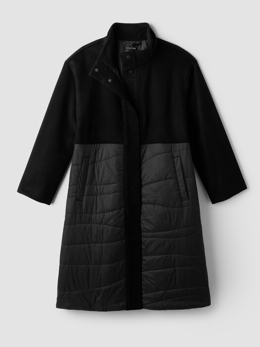 Black stand-collar coat with button front and gray quilted lower panels.