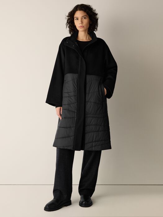 Black stand-collar coat with button closure, hoodless, gray quilted side panels.