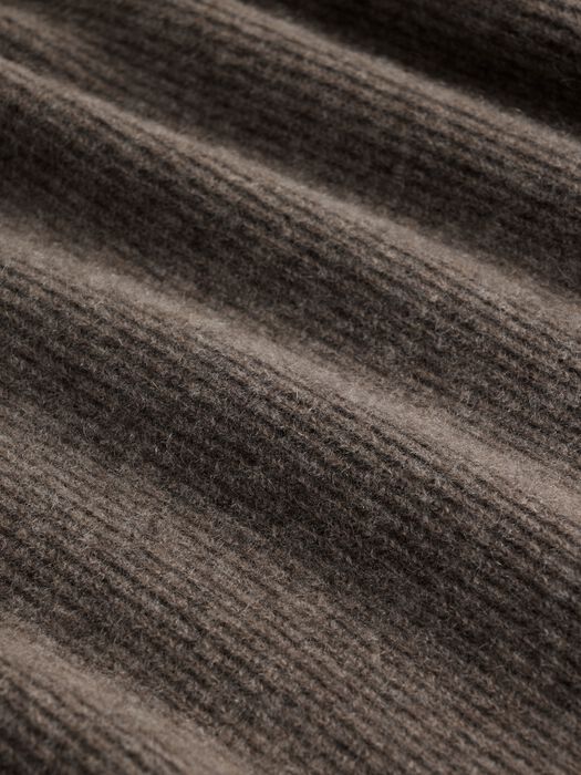 Close-up detail of ribbed cashmere knit fabric in warm taupe-brown tone