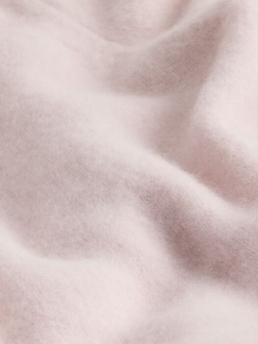 Light mauve textured knit fabric swatch with soft boucle-like surface.