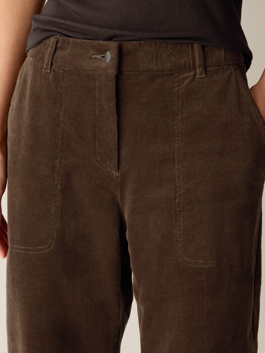Corduroy ankle pants close-up: front pockets and buttoned waistband