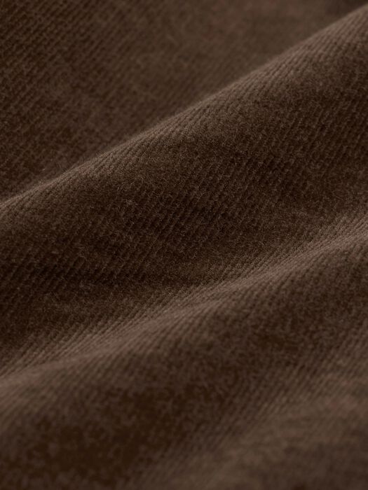 Close-up of dark hazel-brown stretch corduroy fabric texture