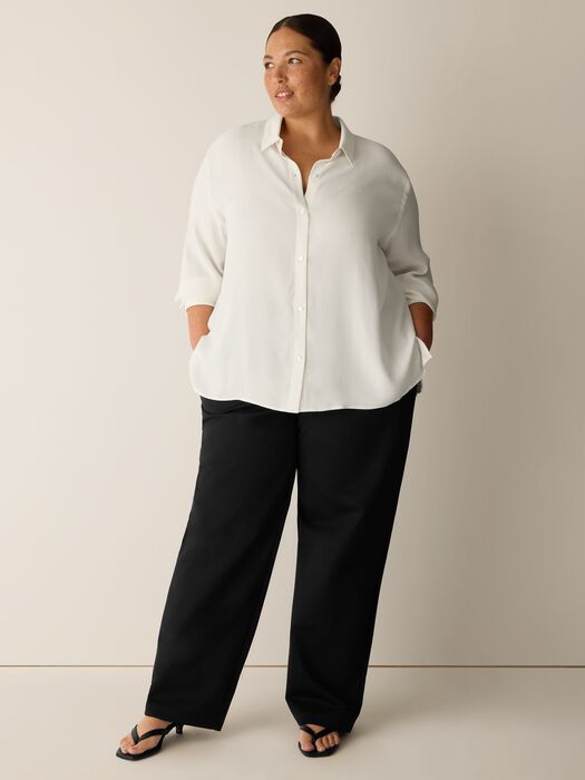 Wide-leg straight black trousers with high waist, shown on model from front view