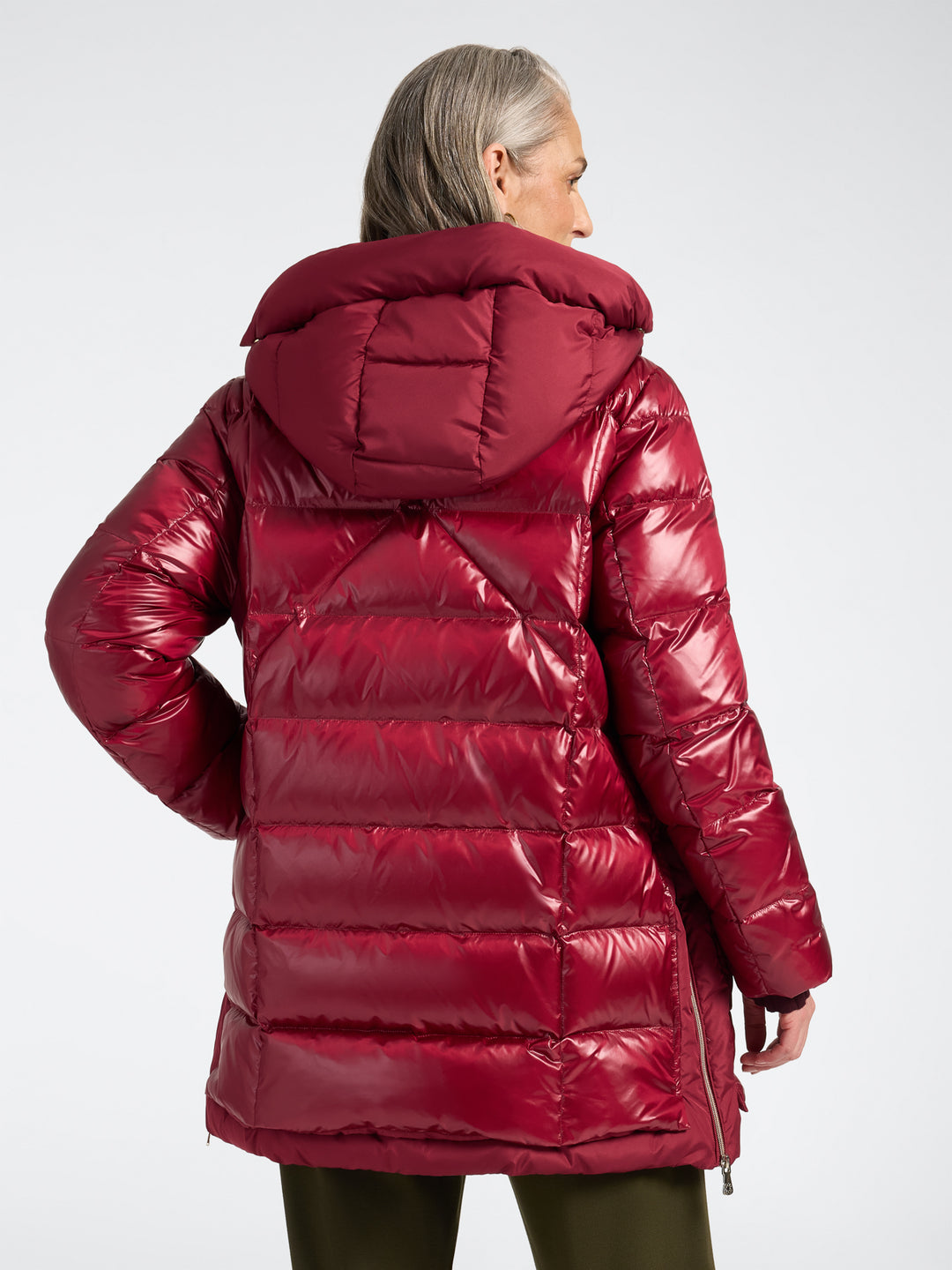 Deep red hooded puffer jacket back view with quilted baffles and full-length zipper