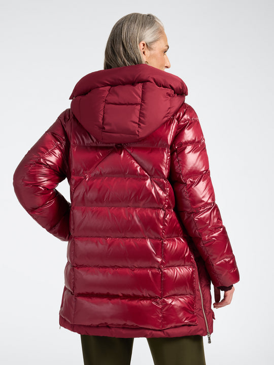 Deep red hooded puffer jacket back view with quilted baffles and full-length zipper
