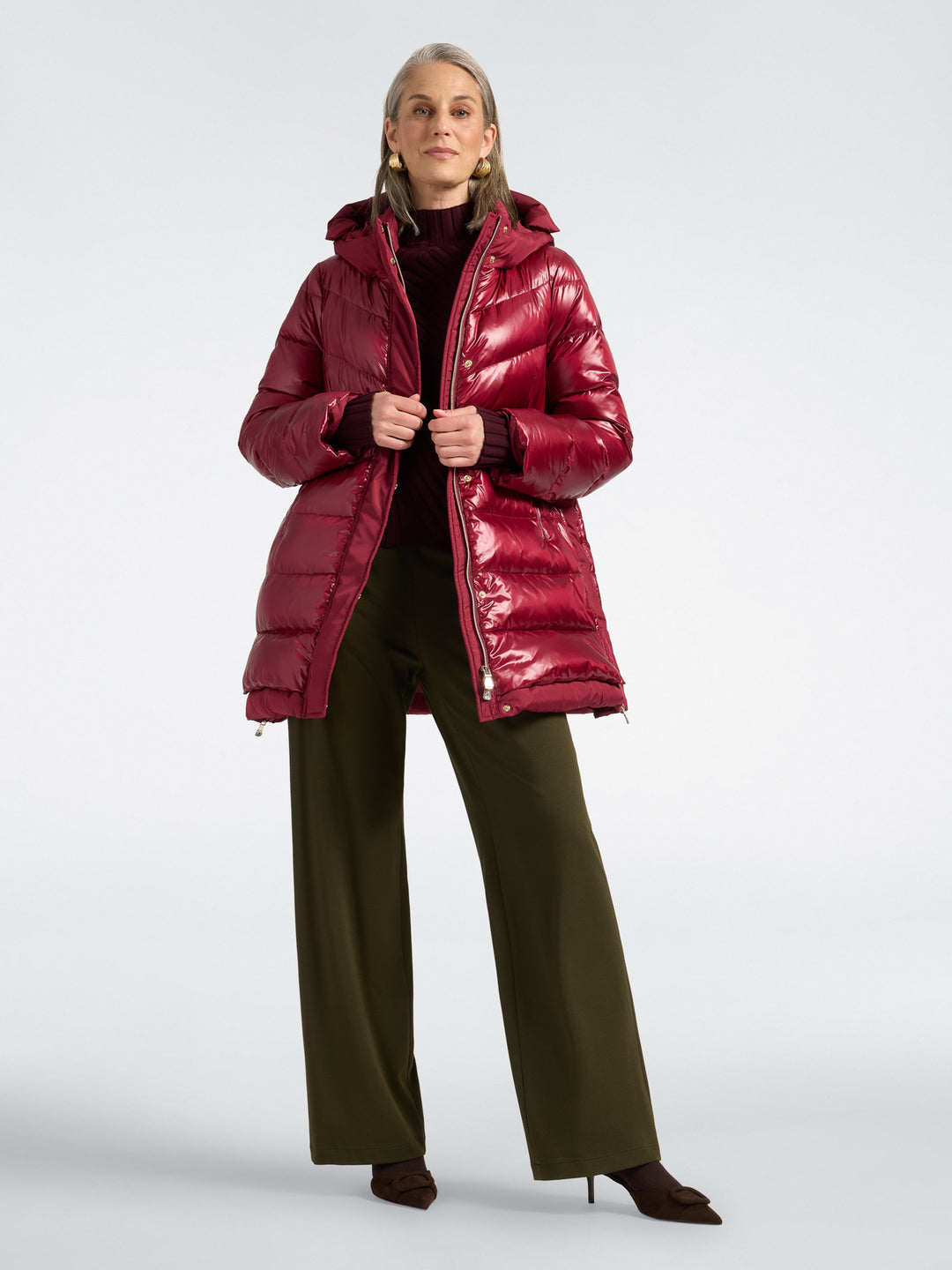 Deep red hooded puffer jacket with zip-front closure and quilted panels