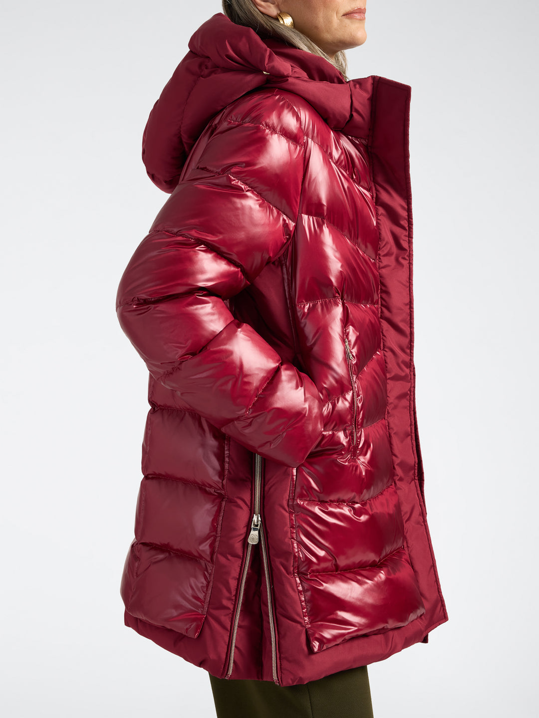 Deep red hooded puffer jacket with high collar, shiny finish, and long zipper