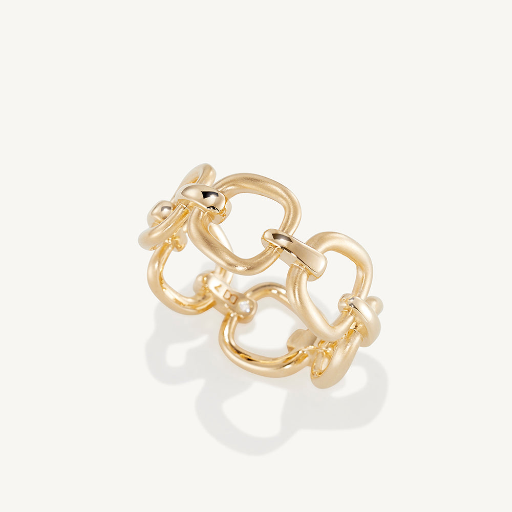 Gold chain-link style ring in angled view with chunky interlocking links