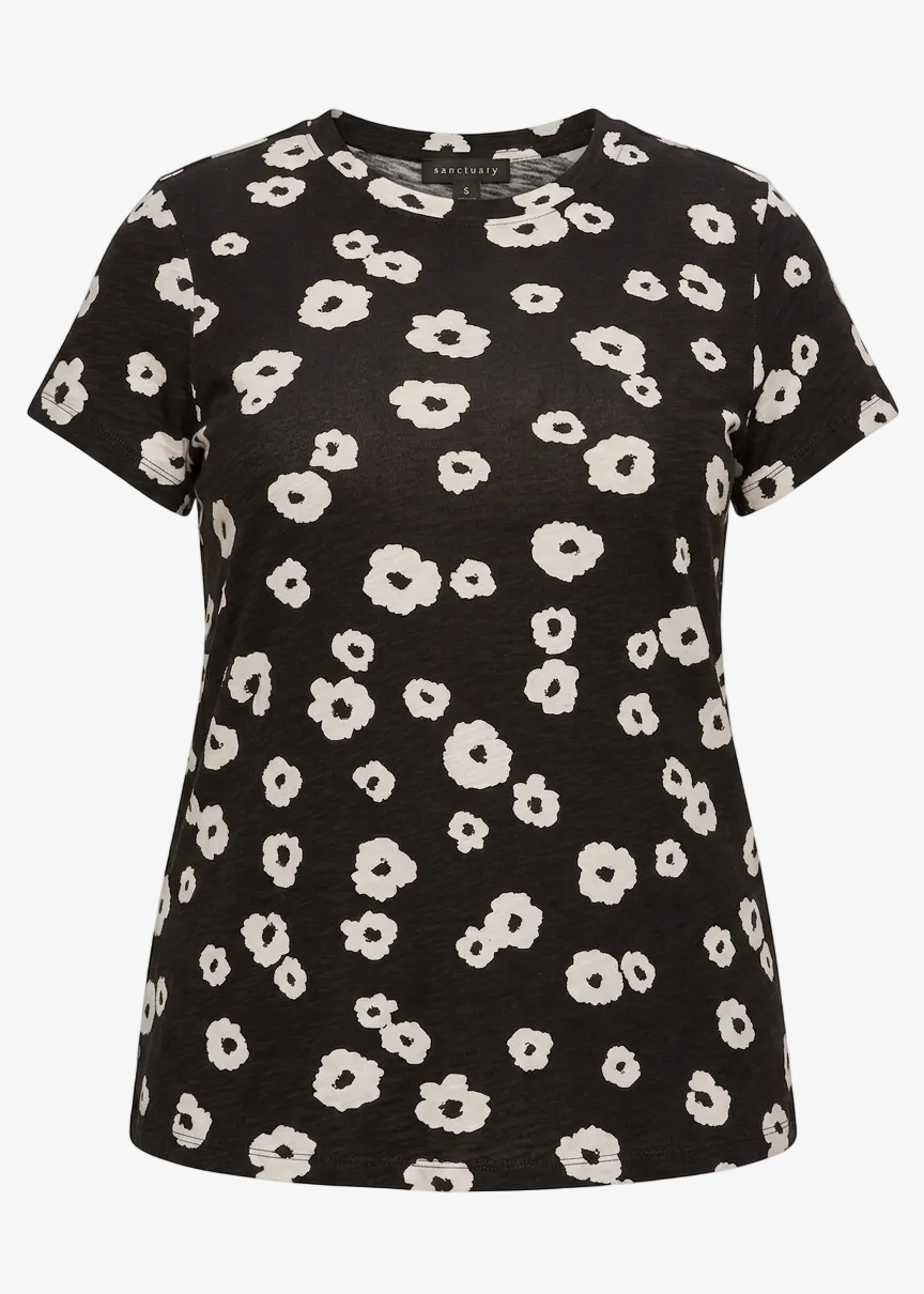 Black t-shirt with white floral pattern on a white background