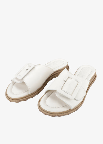 Tyche Monroe Genuine Leather Flat Sandal with Buckle in Cream
