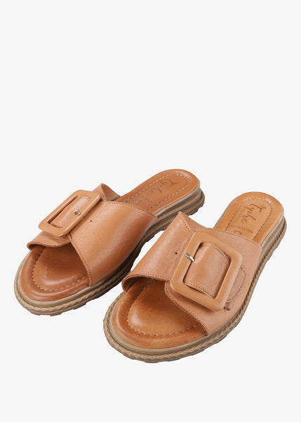 Tyche Monroe Genuine Leather Flat Sandal with Buckle in Cognac
