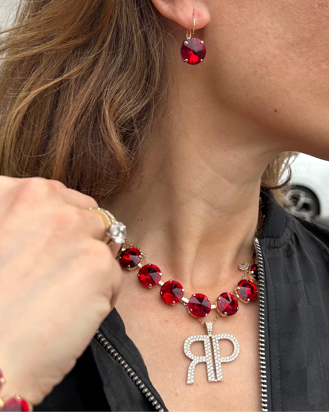Ruby red faceted rivoli necklace with gold-tone chain and oval stones