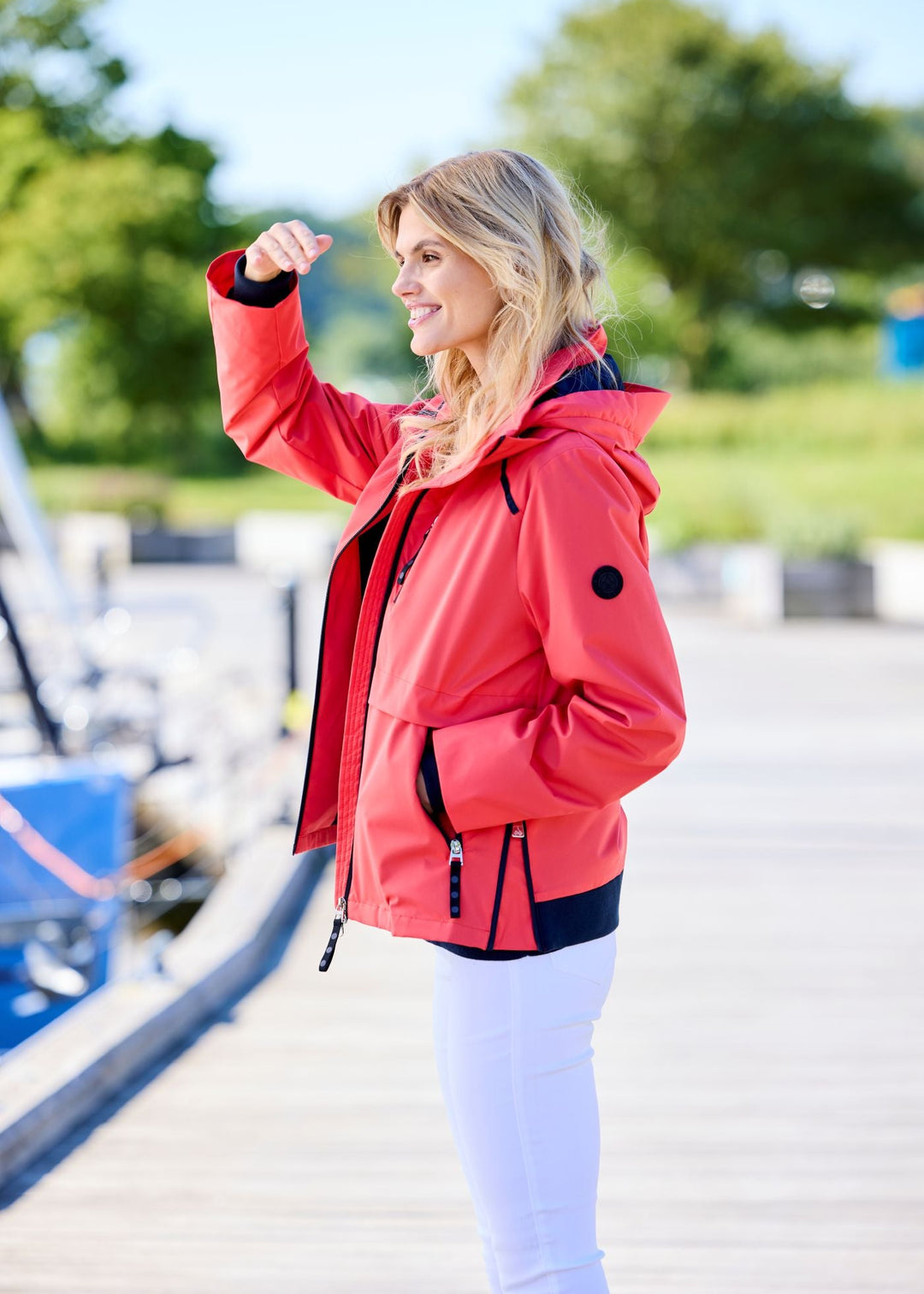 side view of plus size Junge Performance Jacket with Contrast Zipper and Trimmed Hood in Red