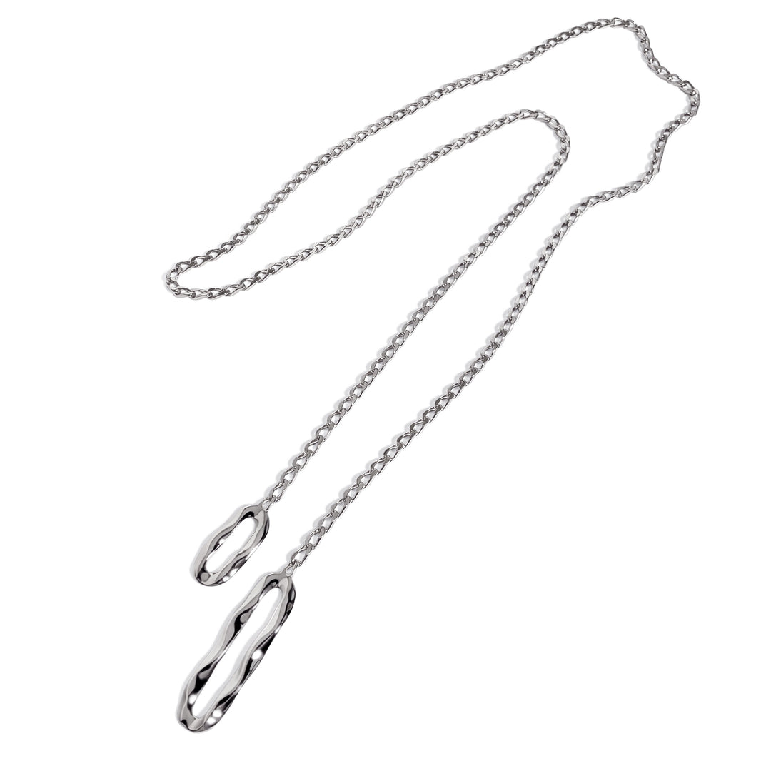 Silver chain lariat necklace with oval pendant ends on white background