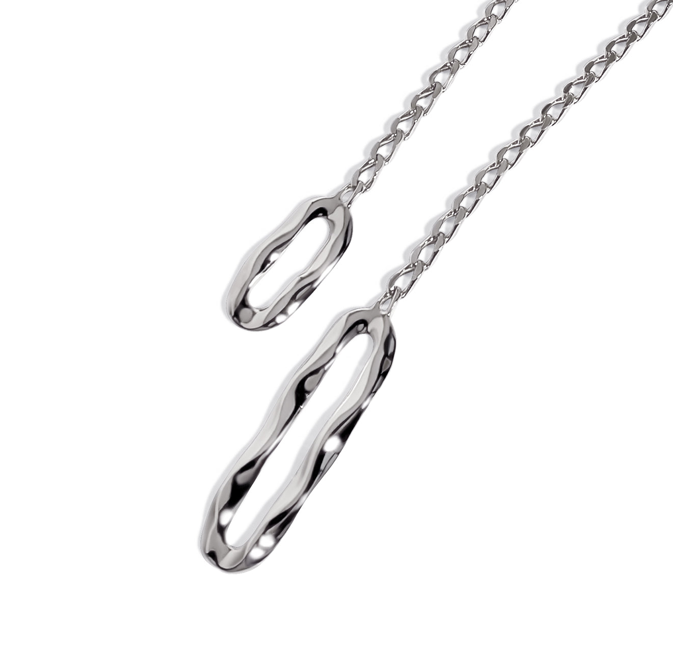 Silver lariat necklace with two oval sculpted links and chain