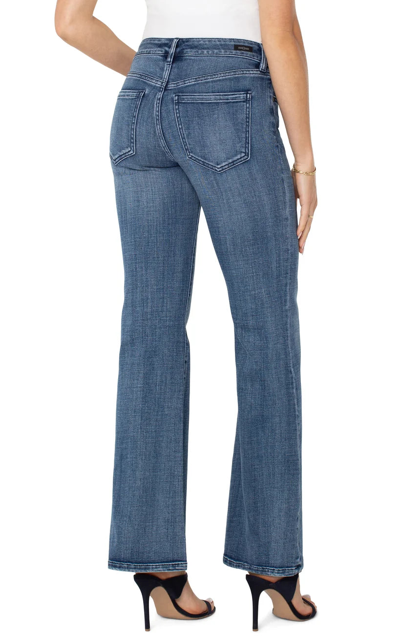 Women's blue flare jeans back view with yoke and patch pockets