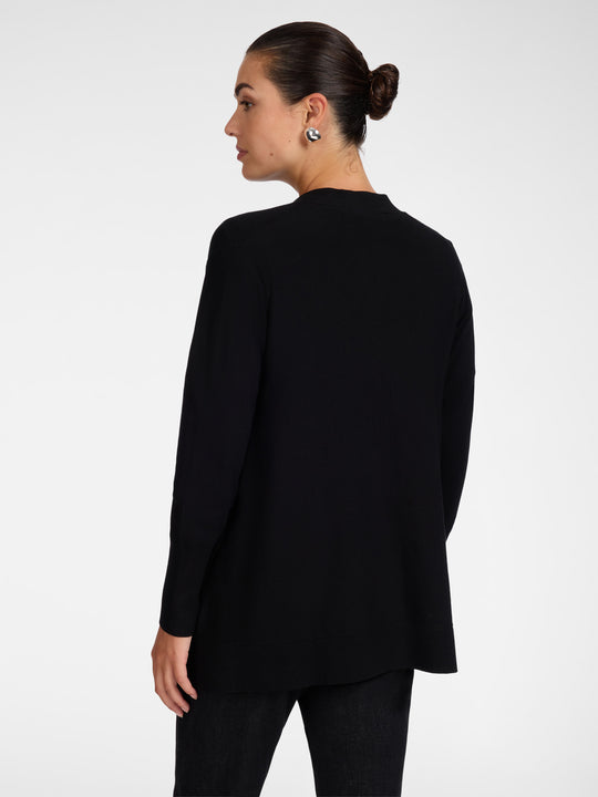 Black flared cardigan back view with long sleeves and curved hem
