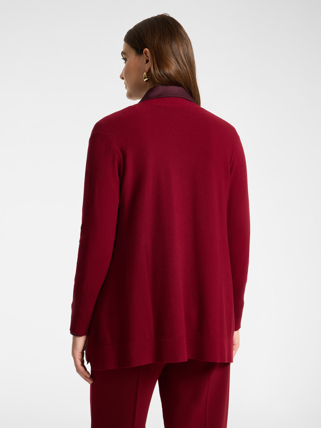 Back view of red flared cardigan with long sleeves and open front
