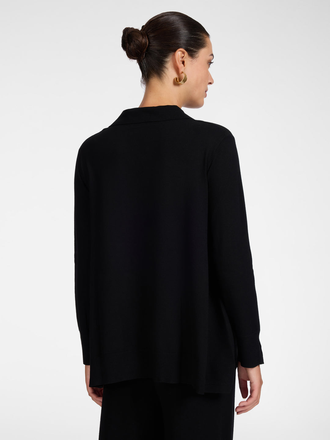 Black polo knit tunic from back view, long sleeves, curved hem