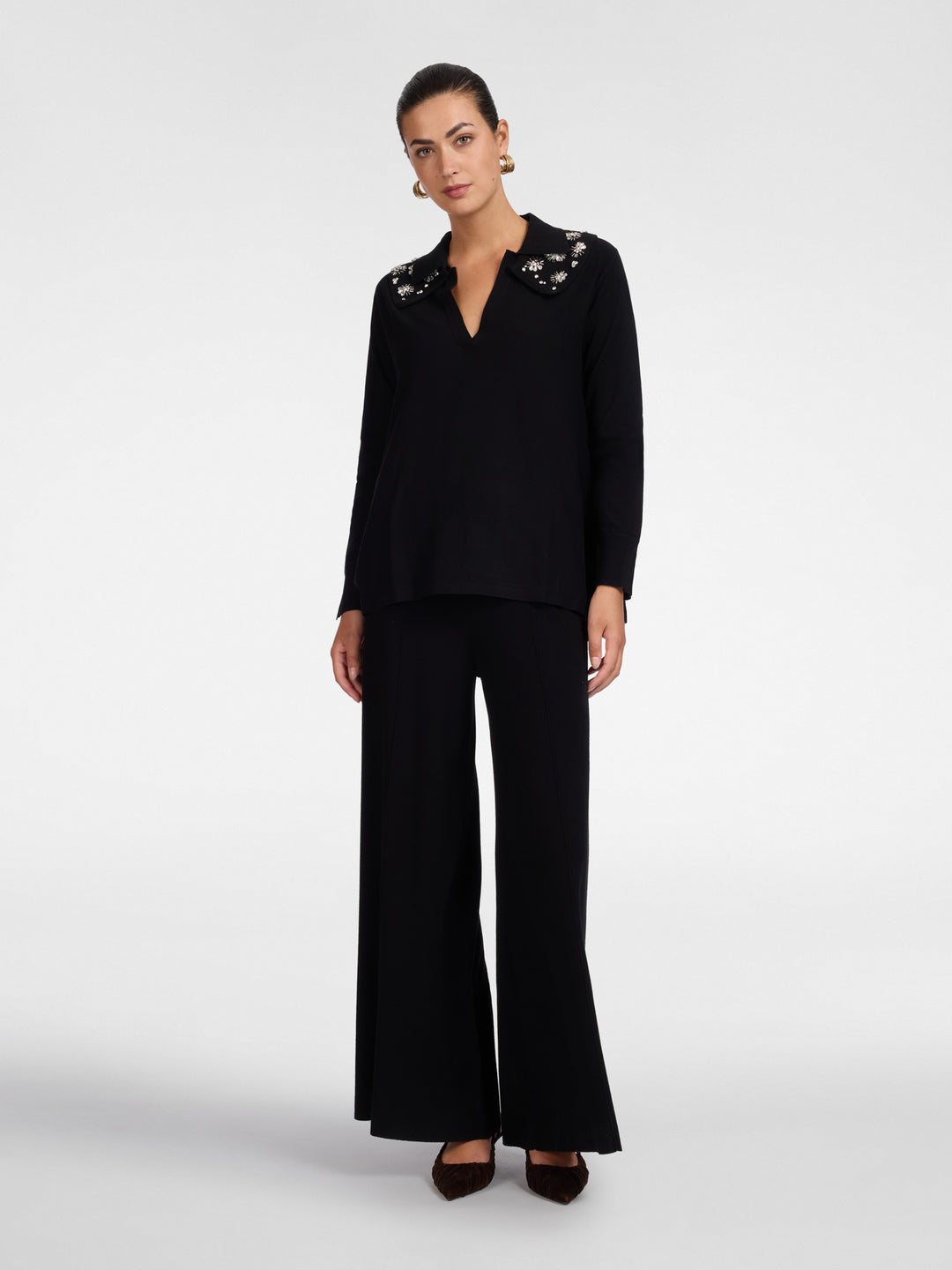 Black polo knit tunic with flared silhouette and three-quarter sleeves